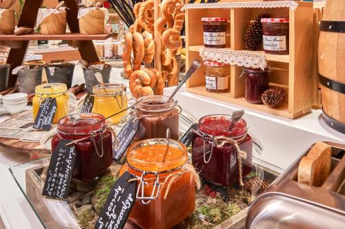 a bakery with jars of honey and bread and pastries at Radisson Blu Resort Bukovel in Bukovel