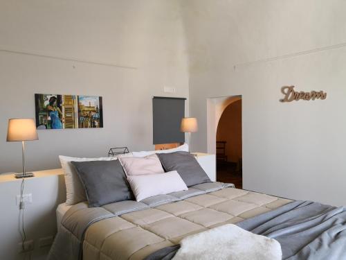 Ένα ή περισσότερα κρεβάτια σε δωμάτιο στο Dimora di Dante