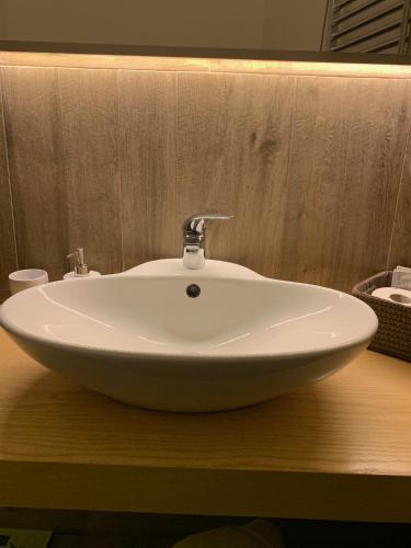 a white sink sitting on a counter in a bathroom at La Banchina Holiday Rooms in Trani