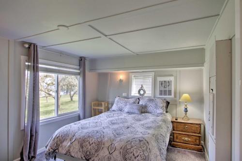 A bed or beds in a room at Waterfront Anderson Island Home with Kayaks