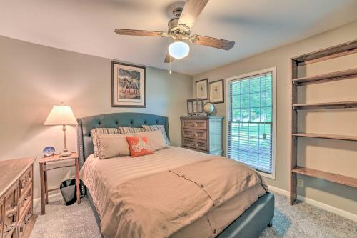 a bedroom with a bed and a ceiling fan at Calvert City Home, 8 Miles to Kentucky Lake! in Calvert City