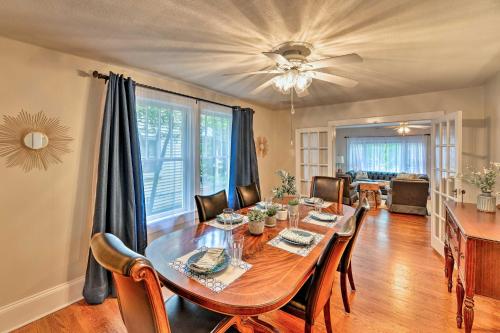 a dining room with a table with chairs and a ceiling fan at New Bern Home with Yard, Grill and Walkable Location in New Bern