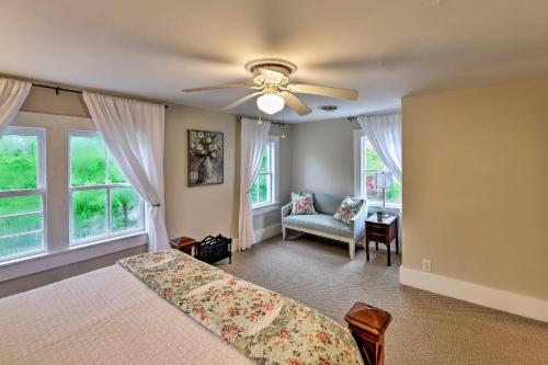 a bedroom with a bed and a ceiling fan at New Bern Home with Yard, Grill and Walkable Location in New Bern