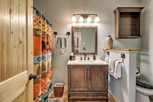a bathroom with a sink and a mirror at Cabin with Porch and View about 19 Mi to West Glacier in Columbia Falls