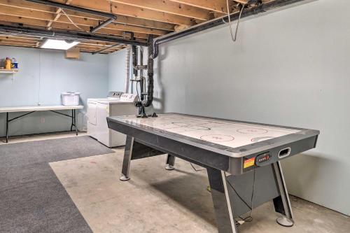 a ping pong table in a garage at Cabin on Kenai Peninsula Family and Group Friendly! in Kenai