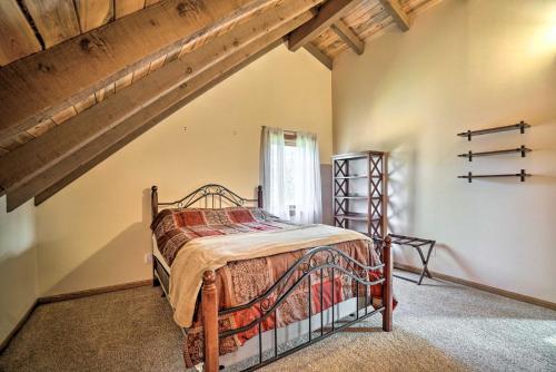 a bedroom with a bed in a attic at Cabin on Kenai Peninsula Family and Group Friendly! in Kenai