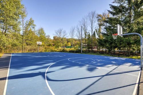 an empty basketball court with a hoop at 1 Mi to Hideout Ski Lake Ariel Home with Fire Pit in Lake Ariel