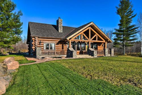 a log cabin with a large yard at North Shore Cabin with Fire Pit By Gooseberry Falls! in Castle Danger