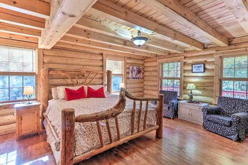 a bedroom with a bed in a log cabin at Grand 4,000 Sq Ft House - 11 Miles to Lancaster! in New Providence