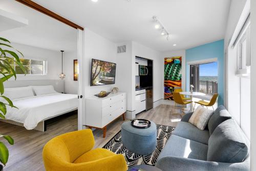 a living room filled with furniture and a large window at Ocean Treasure Beachside Suites in Fort Lauderdale