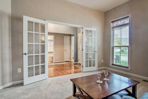 a living room with a table and a window at Great for Groups Bayside Resort Home with Patio in Selbyville