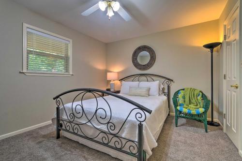 a bedroom with a bed and a mirror and a chair at 9 Mi to Hot Springs Lake Catherine Home with Dock in Price