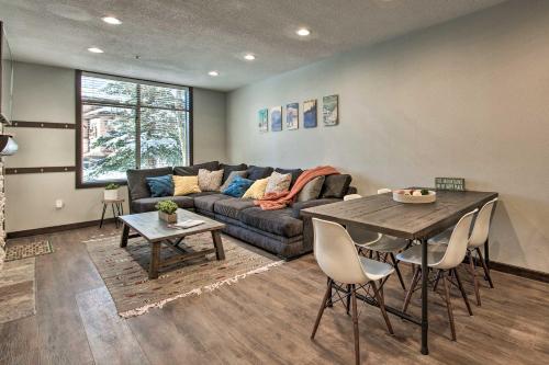 a living room with a couch and a table at Solitude Mountain Slopeside Ski Condo with Hot Tub! in Brighton