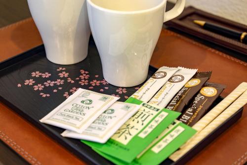 a tray with toothbrushes and a cup on a table at Osaka - Hotel / Vacation STAY 65254 in Osaka