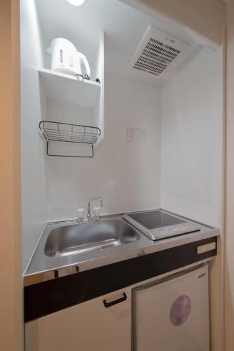 a kitchen with a sink and a counter top at Osaka - Hotel / Vacation STAY 65245 in Osaka