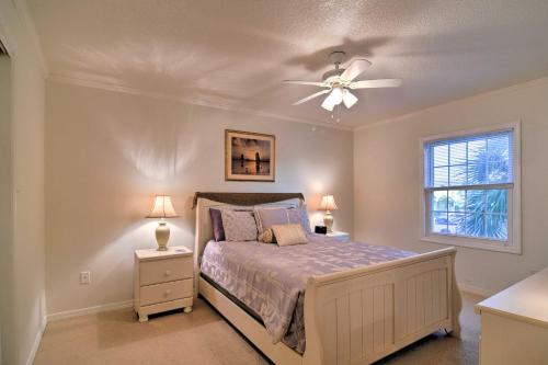 a bedroom with a bed and a ceiling fan at Bayfront Condo 3 Mi to Downtown St Petersburg in St Petersburg