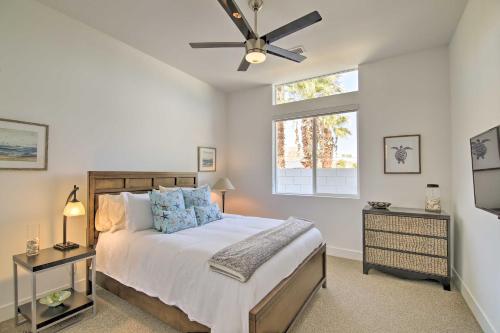 a bedroom with a bed with a ceiling fan at 'Desert Pearl' Oasis with Private Pool - Lower Rates in La Quinta