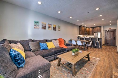 a living room with a couch and a table at Solitude Mountain Slopeside Ski Condo with Hot Tub! in Brighton