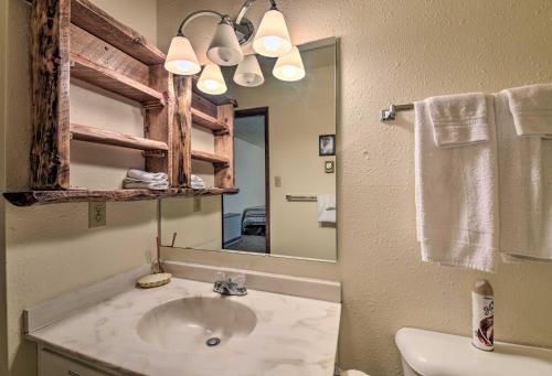 a bathroom with a sink and a mirror at Angel Fire Mtn Escape Walk to Chile Express Lift! in Angel Fire