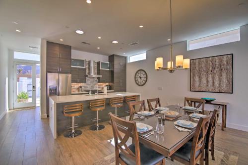 a dining room and kitchen with a table and chairs at 'Desert Pearl' Oasis with Private Pool - Lower Rates in La Quinta