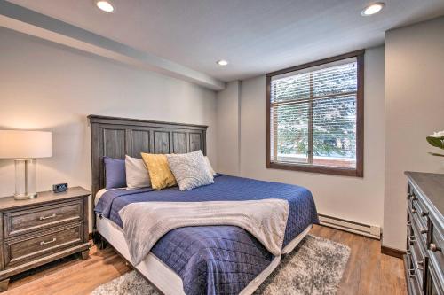 a bedroom with a bed and a window at Solitude Mountain Slopeside Ski Condo with Hot Tub! in Brighton