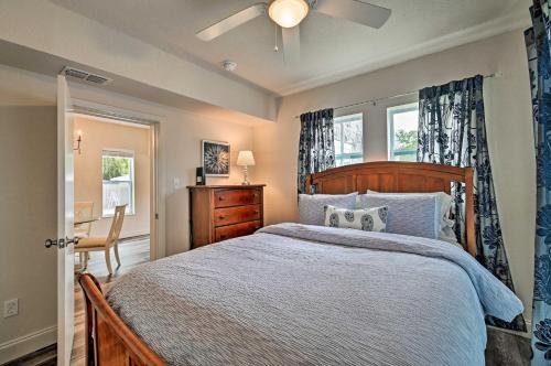 a bedroom with a bed and a ceiling fan at Walk to Dtwn Winter Garden Home with Patio in Orlando