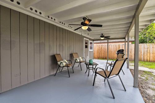 a patio with chairs and a ceiling fan at Walkable Winter Garden Bungalow 3 Blocks to Dtwn in Orlando