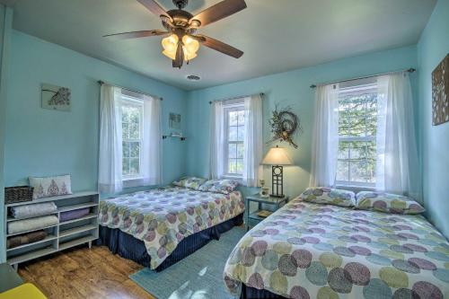a bedroom with two beds and a ceiling fan at Quiet Escape with Hot Tub, 5 Miles to Raystown Lake! in Entriken
