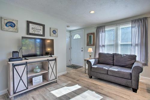 a living room with a couch and a flat screen tv at Updated Plymouth Home Less Than 2 Miles to Waterfront! in Plymouth