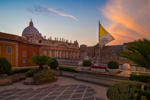 a large building with a flag in front of it at Residenza Paolo VI in Rome