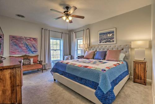 a bedroom with a bed and a ceiling fan at Family Farmhouse on 160-Acre Ranch with Hiking Trail in Lawrenceburg