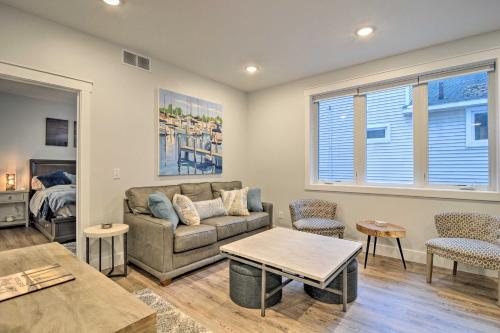 a living room with a couch and a table at Centrally Located Traverse City Condo 1 Mi to Bay in Traverse City