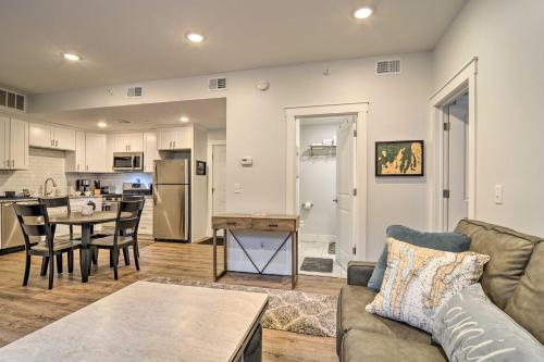 a living room with a couch and a table at Centrally Located Traverse City Condo 1 Mi to Bay in Traverse City