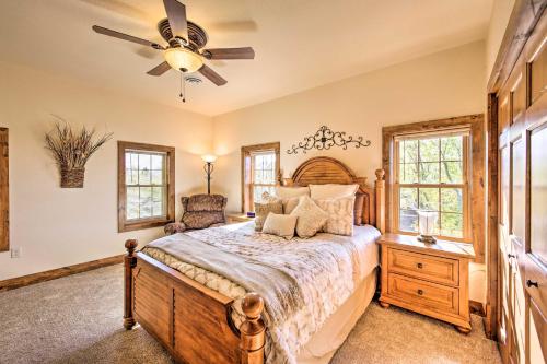 a bedroom with a bed and a ceiling fan at McJuggers Loft Walk to Lake, Park, Restaurants in Campbellsport
