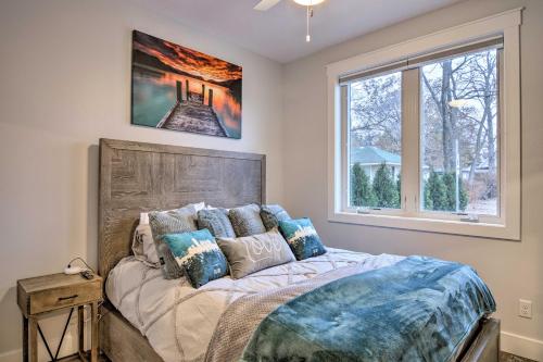 A bed or beds in a room at Modern Michigan Condo about 1 Mi to Grand Traverse Bay