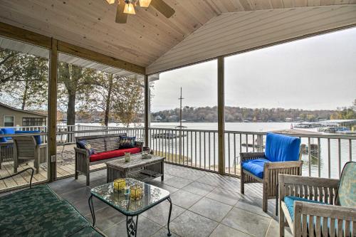 a screened porch with a view of the water at Lily Pad Oasis with Dock on Lake of the Ozarks! in Gravois Mills
