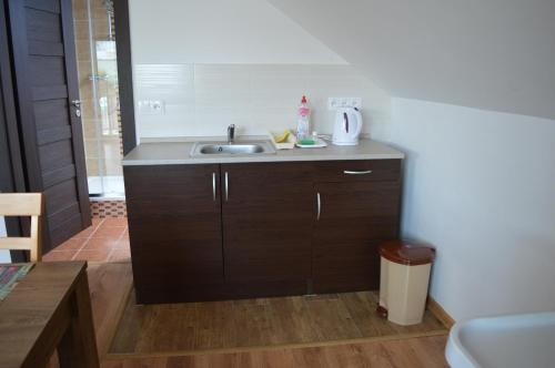 a kitchen with a sink and a counter top at Ubytovanie Luky in Bojnice