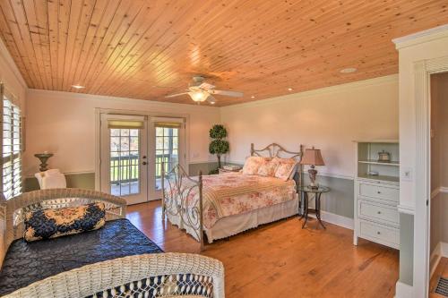 a bedroom with a bed and a wooden ceiling at Serving Southern Charm at this Clarkesville House! in Clarkesville