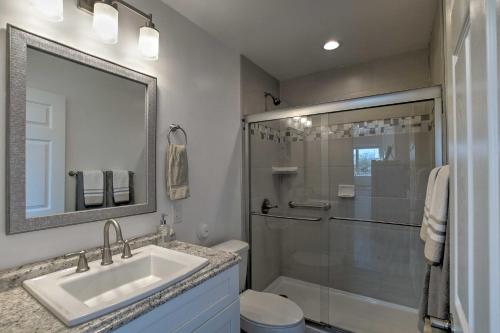 a bathroom with a sink and a shower at Peaceful Peoria Bungalow with Grill and Pool! in Peoria