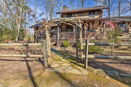 a wooden fence in front of a house at Cabin Near Boone with Hot Tub and Mountain Views in Fleetwood