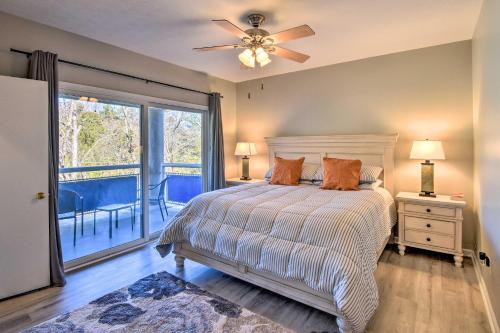 a bedroom with a bed with a ceiling fan and a balcony at Lake Keowee Resort Condo Pool, Beach, Golf Access in Salem
