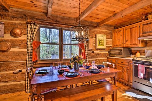 a kitchen with a wooden table in a cabin at Cabin Near Boone with Hot Tub and Mountain Views in Fleetwood
