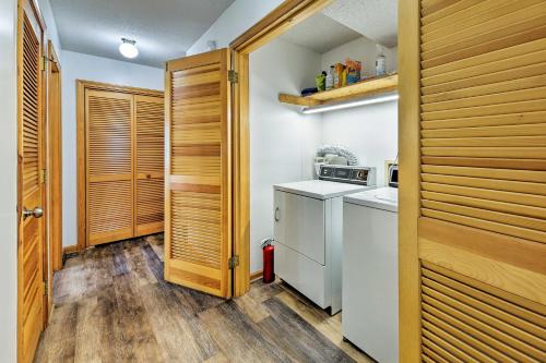 a small kitchen with a washer and dryer at Bright Southern Shores Family Home Less Than 1 Mi to Beach in Southern Shores