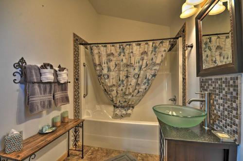 a bathroom with a sink and a bath tub at Coastal Retreat in Long Beach Walk to Attractions in Long Beach