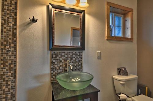 a bathroom with a green bowl sink on a counter at Coastal Retreat in Long Beach Walk to Attractions in Long Beach