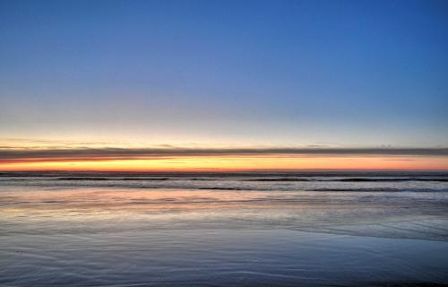 a view of the ocean at sunset at Coastal Retreat in Long Beach Walk to Attractions in Long Beach