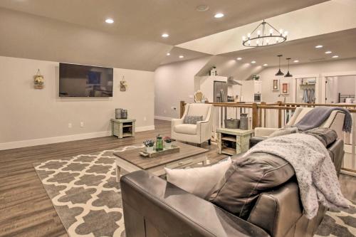 a living room with a couch and a tv at Chic Farmhouse with Creek in Heart of Wine Country! in McMinnville