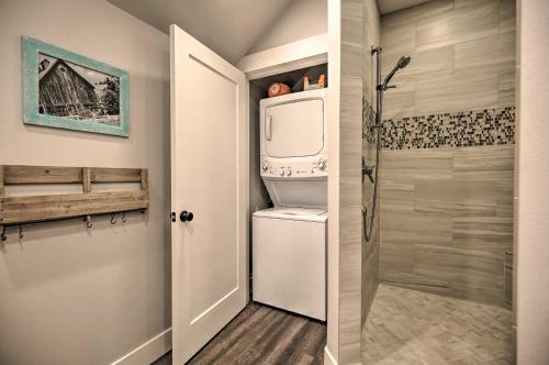 a small bathroom with a refrigerator and a shower at Chic Farmhouse with Creek in Heart of Wine Country! in McMinnville