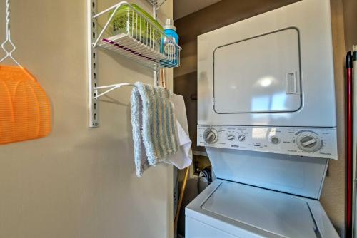 a laundry room with a washer and dryer at Condo on Golf Course 2 Mi to Grindstone Lake! in Ruidoso