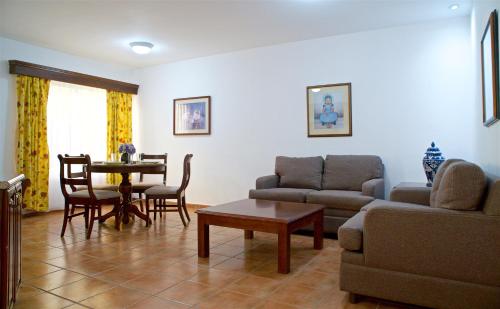 a living room with a couch and a table at Best Western Saltillo in Saltillo